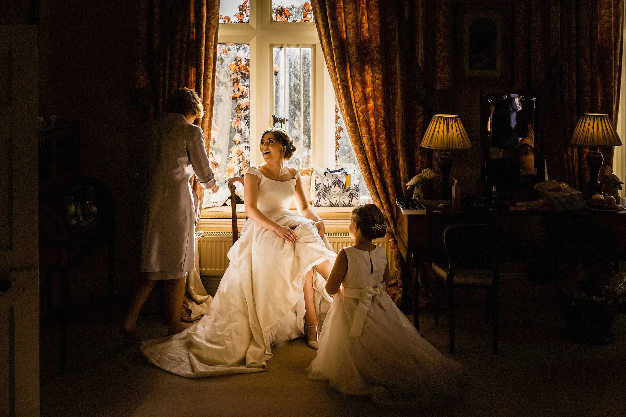 how to get the best getting ready photos. bride sat in window at carlton towers
