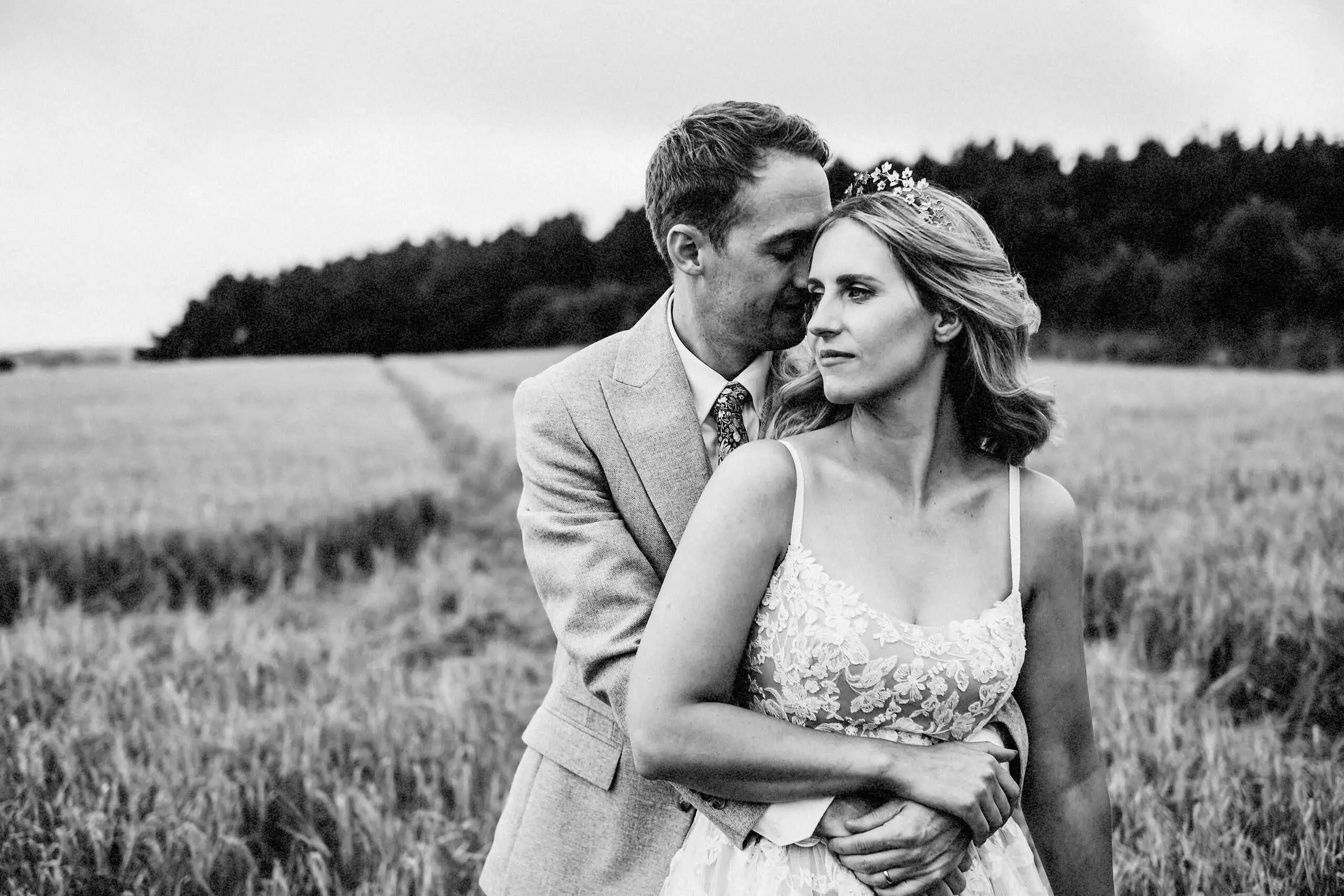 wedding photographer newcastle upon tyne black and white image of bride and groom in a cornfield by north east wedding photographer andy turner
