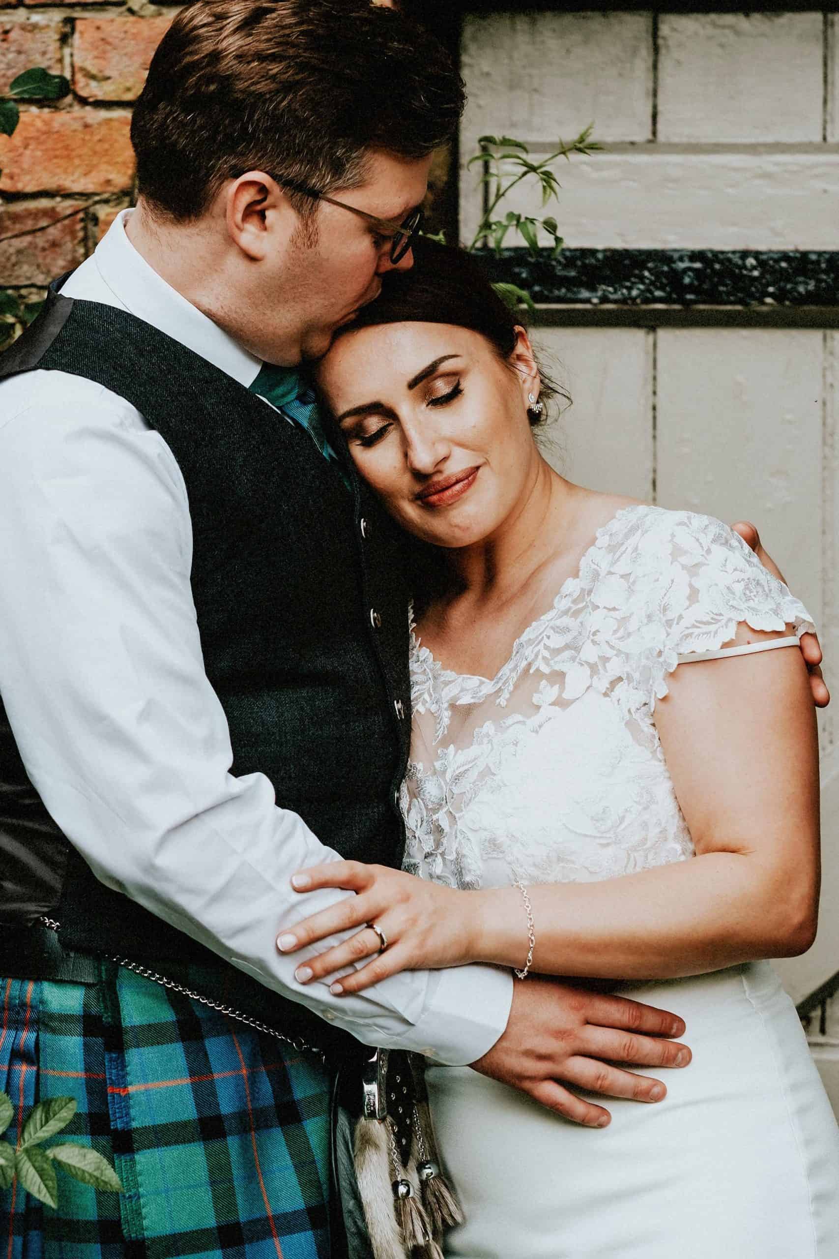 Bride and groom embracing