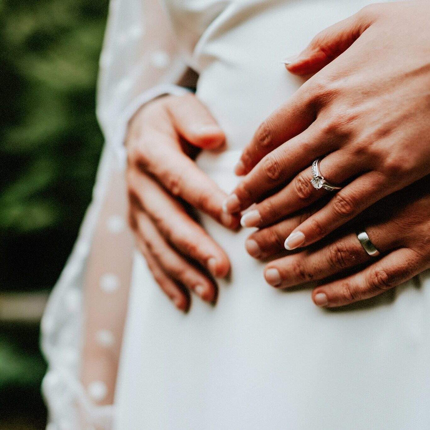 Bride and groom's hands showing wedding rings