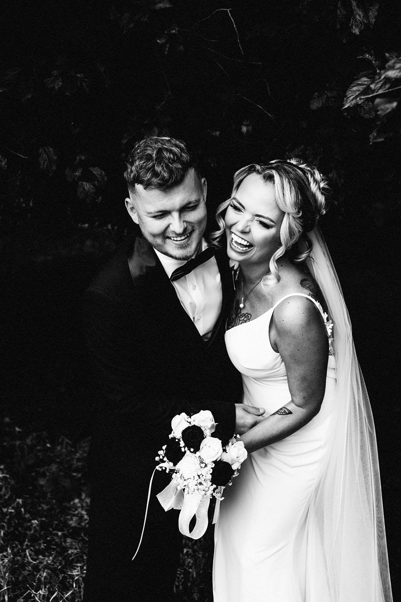 A black and white portrait of Emma and Callam at their Crathorne Hall wedding